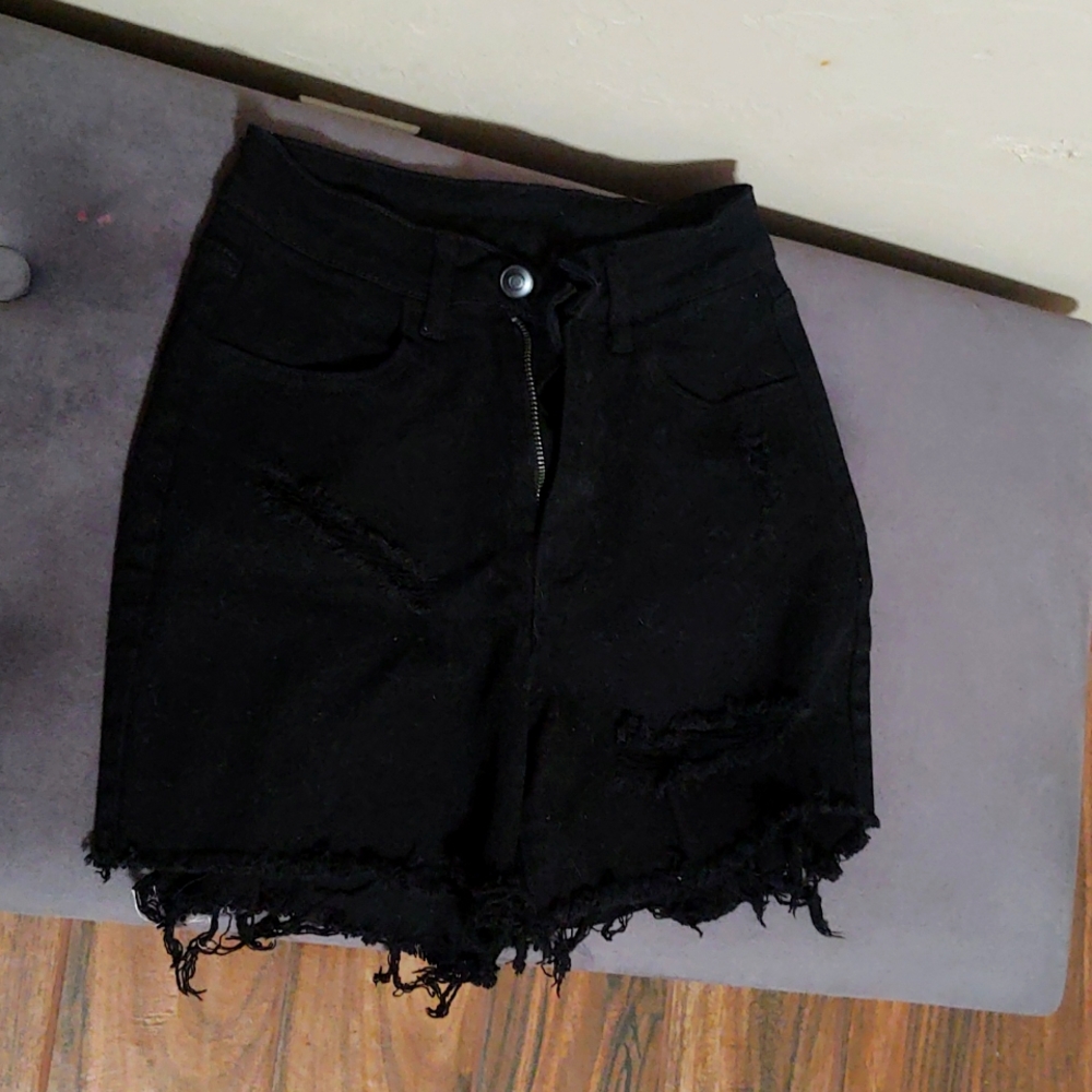 Black riped shorts ripped on the back on the side